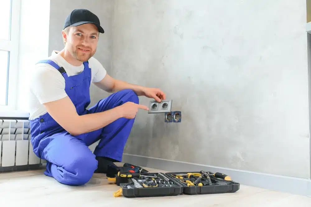 electrician contractor fixing a plug